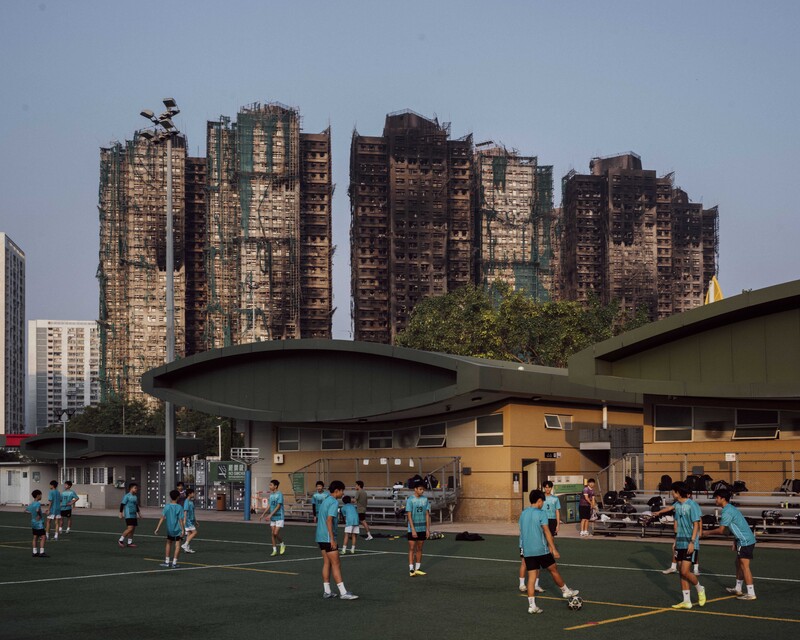 Aftermath of Hong Kong Fire by Lucien Lung / Riva Press