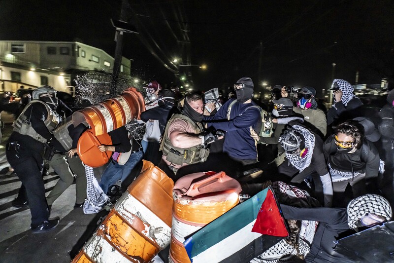 Clashes Outside Delaney Hall by Mark Peterson