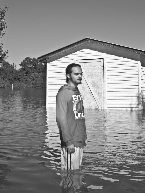 Trent Brown poses for a portrait in floodwaters after the landfall of hurricane Matthew caused flooding which killed several and stranded hundreds of residents in Lumberton, N.C., on Monday, October 10, 2016.