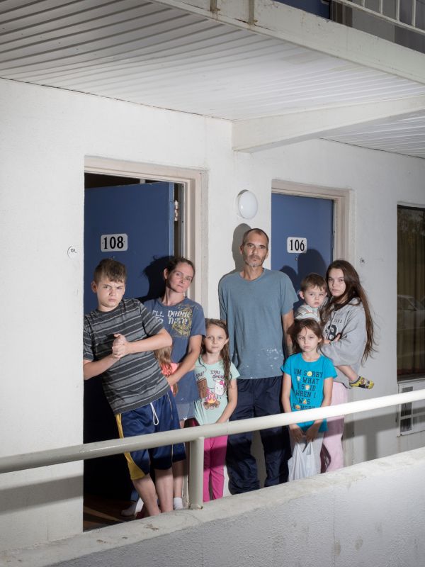 The Brown family from Jacksonville, North Carolina poses for a portrait at a Motel 6 hotel on Buck Jones Road after fleeing Hurricane Florence in Cary, North Carolina on September 14, 2018.