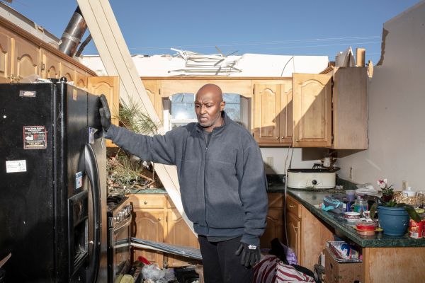 Calvin Fields poses for a portrait in his mother-in-law's home after a tornado passed over killing several people and destroying homes in Beauregard, Alabama on March 5, 2019.