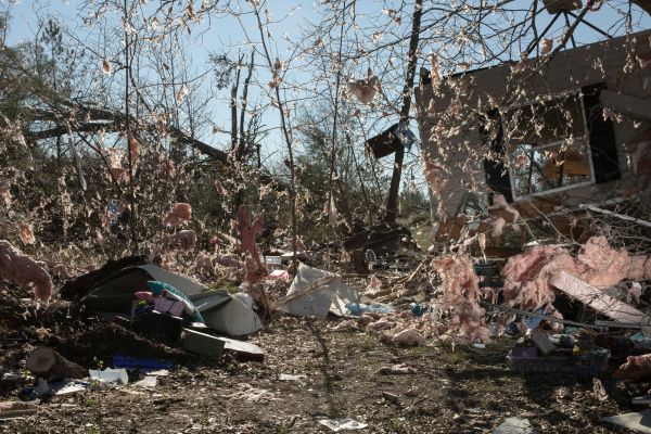 Insulation from a home was scattered in the trees after a tornado passed over killing several people and destroying homes in Beauregard, Ala., on Monday, March 4, 2019.