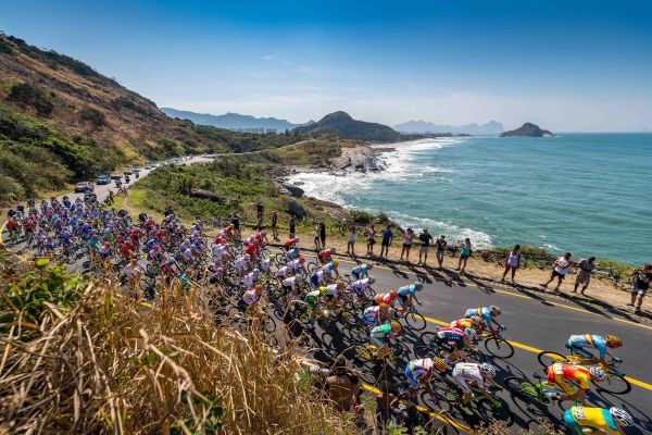 The main pack of cyclists pass along the coast during men's road cycling at the Rio 2016 summer Olympic games.