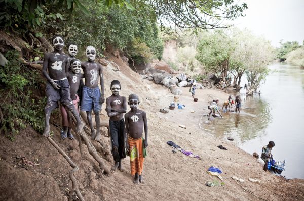 Young boys pose for a portrait on the banks of River Gambia in Senegal.