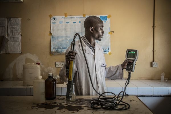 Lab technician, Badou Saine at the lab at the Department of Water Resources, in The Gambia.