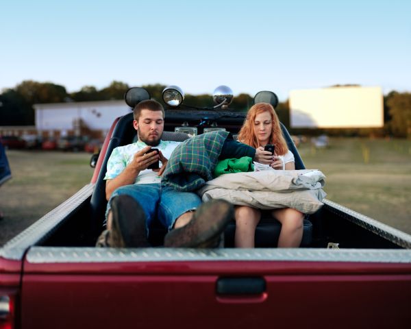 Two People on the Back of a Car