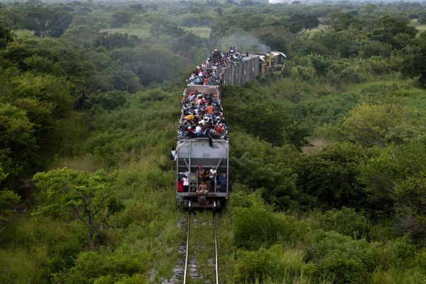 Illegal migrants ride a cargo train, called The Beast, towards the city of Ixtepec, Mexico, September 22, 2011.