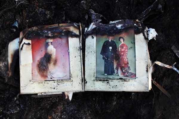 Nearly burned out wedding album remained at a tsunami destroyed and burned down area in Kesennuma, Miyagi