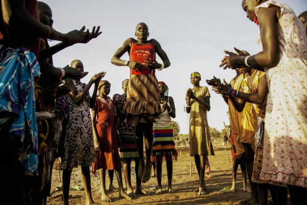 Girls of Agar tribe perform Danny dace in a cattle camp in South Sudan where cattle raids often take place and destabilize the possibly new country.
