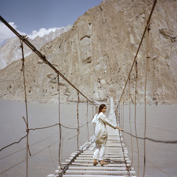 Subeera Hussain, a British Pakistani walks along the Passu hanging bridge near the town of Passu in Hunza Valley, Pakistan on July 13, 2018.