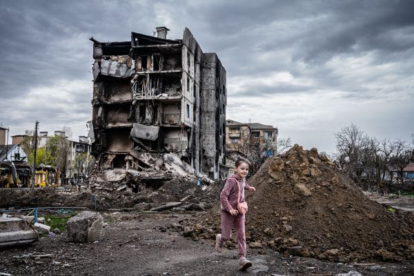 Residents survey residential buildings destroyed during battles between invading Russian forces and the Ukrainian military, Borodyanka, Ukraine, April 25, 2022.