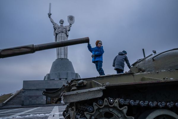 Kid Standing on a Tank
