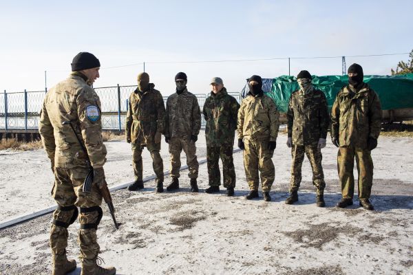 Members of the Mariupol Self-Defense force train on a beach along the Azov Sea a during a weekly training session a week after Russia fired on three Ukrainian ships and took 24 Ukrainian sailors captive near the Kerch Strait, which connects the Black Sea and the Sea of Azov.