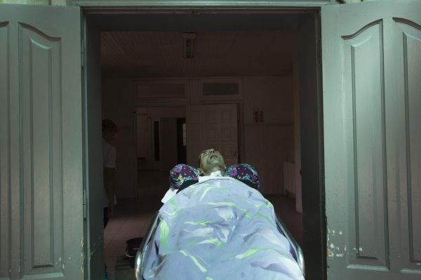 Roman Kubishkin, a 41 year-old construction worker, is rolled into a hospital where he lives and undergoes therapy.