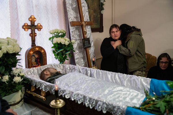 Tanya Vichysta-Pelish, embraces her daughter-in-law Albina at her son’s, Vasyl Pelish's, funeral in the western Ukrainian city of Stariy Sambir.