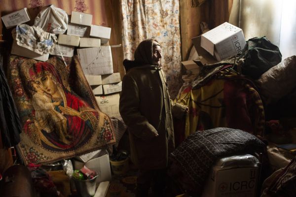Marija Gorpynych, 88, stands in her home, which was damaged during heavy fighting between Russian supported separatists and Ukrainian forces in Opytne, a village sandwiched between the outskirts of the industrial city of Avdiivka and the Russian supported separatist held city of Donetsk.