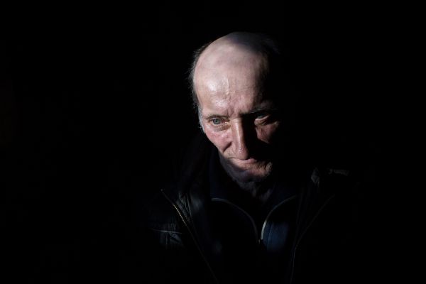 Valentin Olejnik, 57, sits in his home in Krymske, which was heavily damaged during fighting between Russian supported separatists and Ukrainian forces. His home is being rebuilt with the assistance if international NGOs.