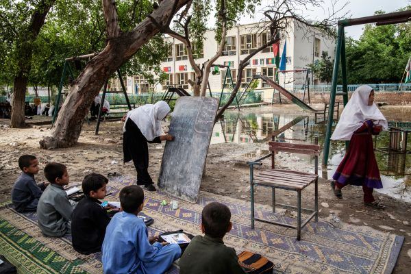 Due to overcrowding and some dilapidation of the classrooms, many of the classes are held outdoors.
