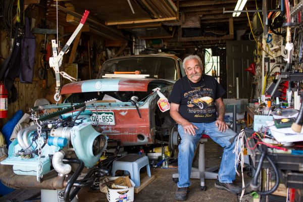William Schweizer, Sr. works on a car in his garage in Leadville, Colorado.