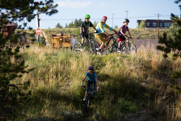Kids warm up on their bikes before a family trail ride with the Cloud City Wheelers, a bike club which promotes cycling opportunities, and has been building and maintaining trail systems in Leadville and Lake County, Colorado since 2007.
