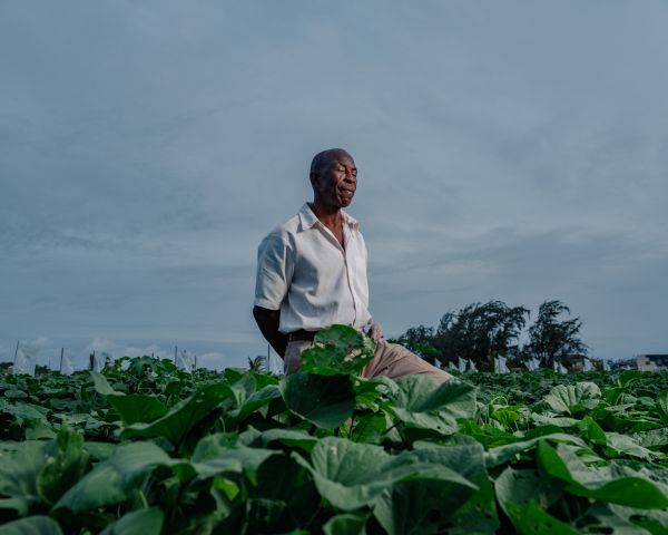 Kenneth Blaze is farmer who has rights to farm 5 acres but only has water for 2 or so, site is adjacent to a long-planned government irrigation complex that remains unfinished.