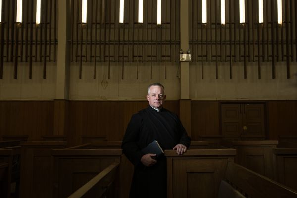 Portrait of Anglican Priest and Exorcist Erich Junger in a church in Bangkok, Thailand.