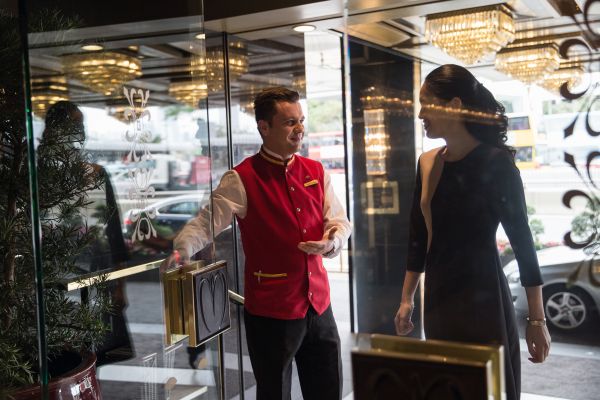 Opening the door at the Mandarin Oriental in Hong Kong.