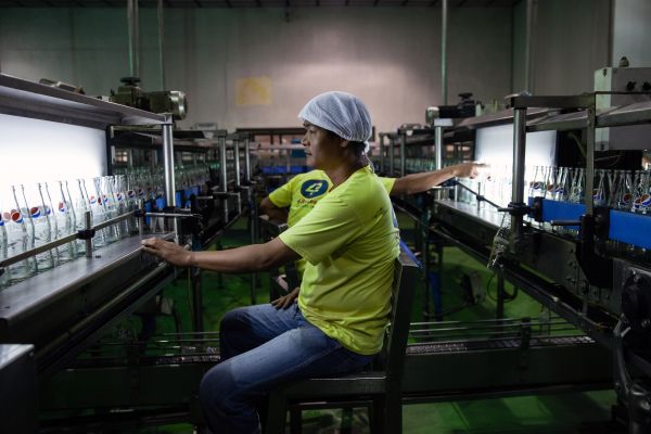 Workers inside a Pepsi bottling facility in the Philippines.