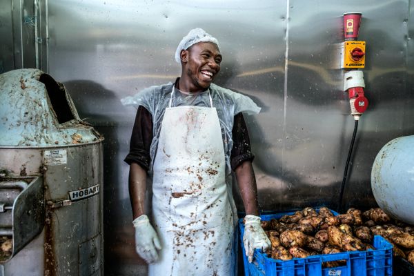 In a string of Nairobi warehouses Java House's culinary team prepare food and beverages to be distributed to the company's growing number of restaurants, including roasting their own coffee beans and baking their own bread and pastries.