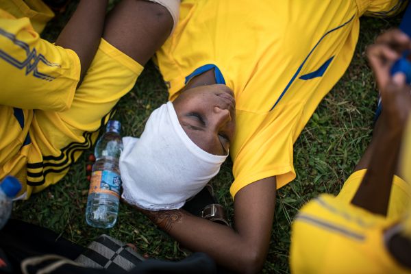 Green Queens player Rukia Taleb (19) rests during halftime. The first game of the season for Zanzibar's women's soccer clubs saw the Jumbi Women Fighters beat the Green Queens 2:0 on the island's Jumbi pitch, on June 18, 2018.