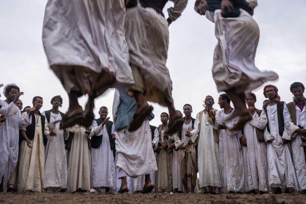 Men from the Red Sea Mountains celebrate the wedding of Musa Wad Alomda by competing for the highest leap, in Uorhaib Village, Sudan, on September 20, 2020.