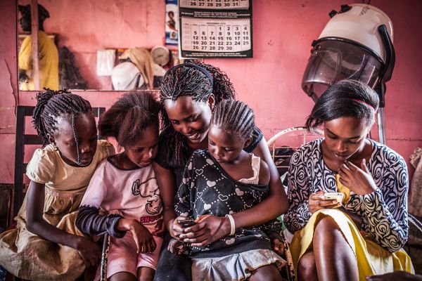 Elizabeth helps her mom out at the hair salon she works at in Gachie, a rapidly expanding suburb of Nairobi.