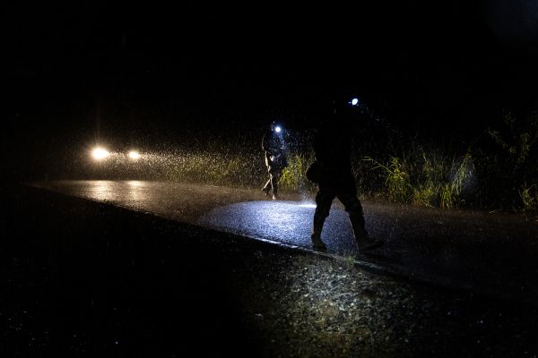 Tha Takiap, Chachoengsao province. Forest rangers and community volunteers patrol farmland around their village to expel a herd of wild elephants.