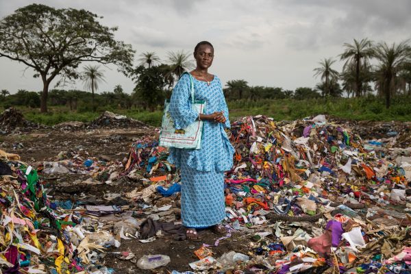 Isatou Ceesay stands at a waste dump in the town of Birkama.