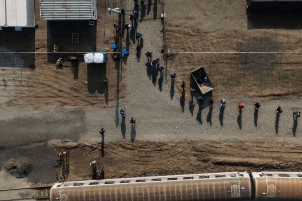 Refugees and migrants in the Croatian winter transitcamp Slavonski Brod are marched towards the train that will take them to Slovenia.