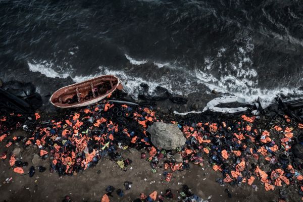 Rescueboats, rubber dinghys and lifevests lie on the beach of Greek island of Lesbos.
