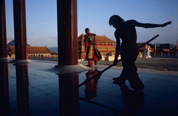 Trained at Shaolin Martial Arts Elementary School, Shi Baoqing practices martial arts moves while waiting to be called in his role as palace guard for filming of the Zheng He story at Hengdian World Studios in Hengdian village in Zhejiang China.