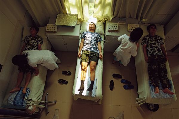 Young Chinese enrolled in the internet addiction rehabilitation program at Baiyun mental health hospital in Guangzhou, China, spend time each day undergoing acupuncture as part of their therapy.