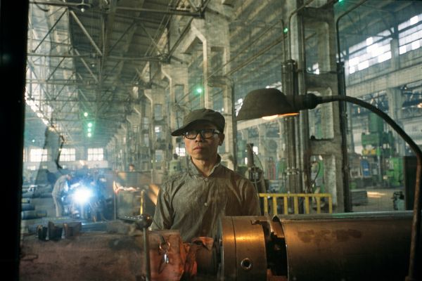 Lathe man Ma Weilong at his post on the assembly line of a former state-run weapons plant in Shenyang, China.
