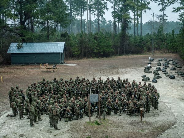 Recent graduates of boot camp, U.S. Marine Corp soldiers receive orders before setting out to undergo land navigation training in the woodlands at Camp Devil Dog on the Marine Corp Base Camp Lejeune, North Carolina, U.S.A.