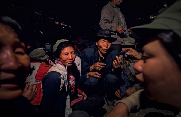 Following the custom of the Lisu ethnic minority in Yunnan, China, the families of bride and groom come together to mark the payment of a monetary endowment paid by the grooms family to the brides.