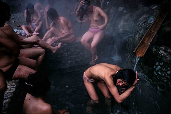 Women of China’s Lisu minority bathe together in the hot springs of the Mabu River, a tributary that feeds the Nu River north of the town called Liuku.