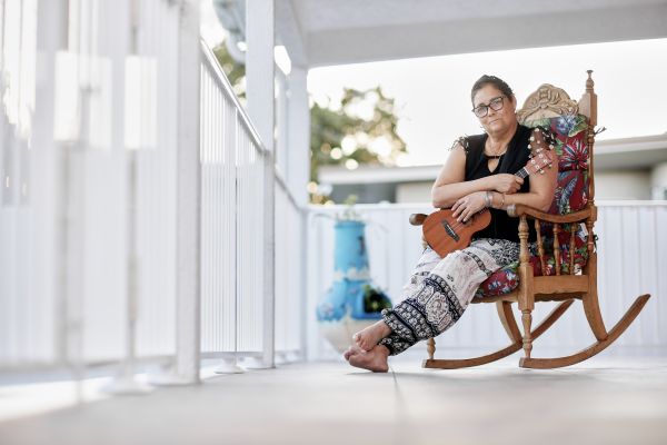 Loida Valdes Rodriguez - Cancer survivor - who plays Ukele at her home.